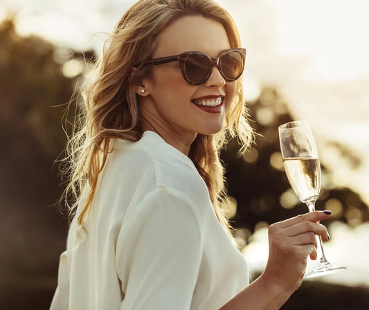 Elegant woman enjoying glass of Prosecco